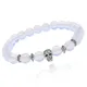 Браслет-амулет Череп с синт. камнем Лунный камень 8мм BSHE-02-11S